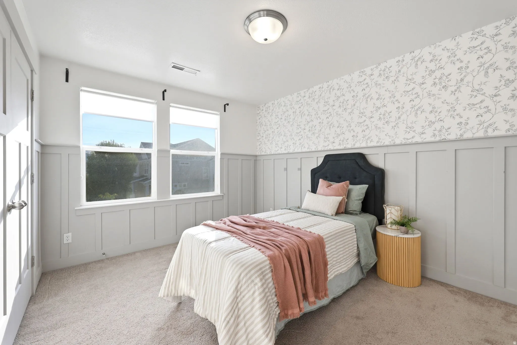 Board and batten wainscoting with patterned wallpaper accent wall