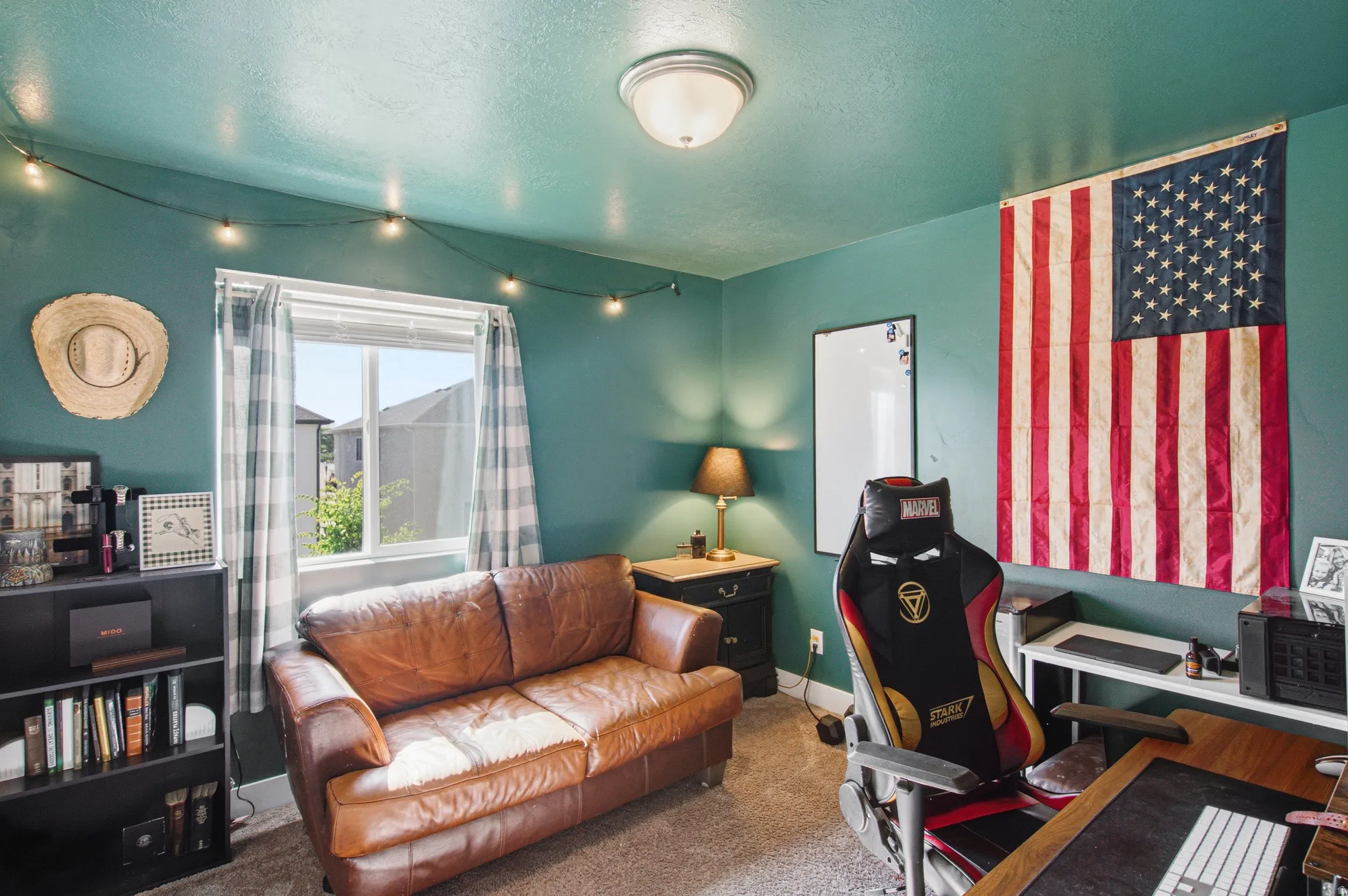 Bright room featuring a double-pane window, wall-to-wall carpeting, and a flush-mount ceiling light
