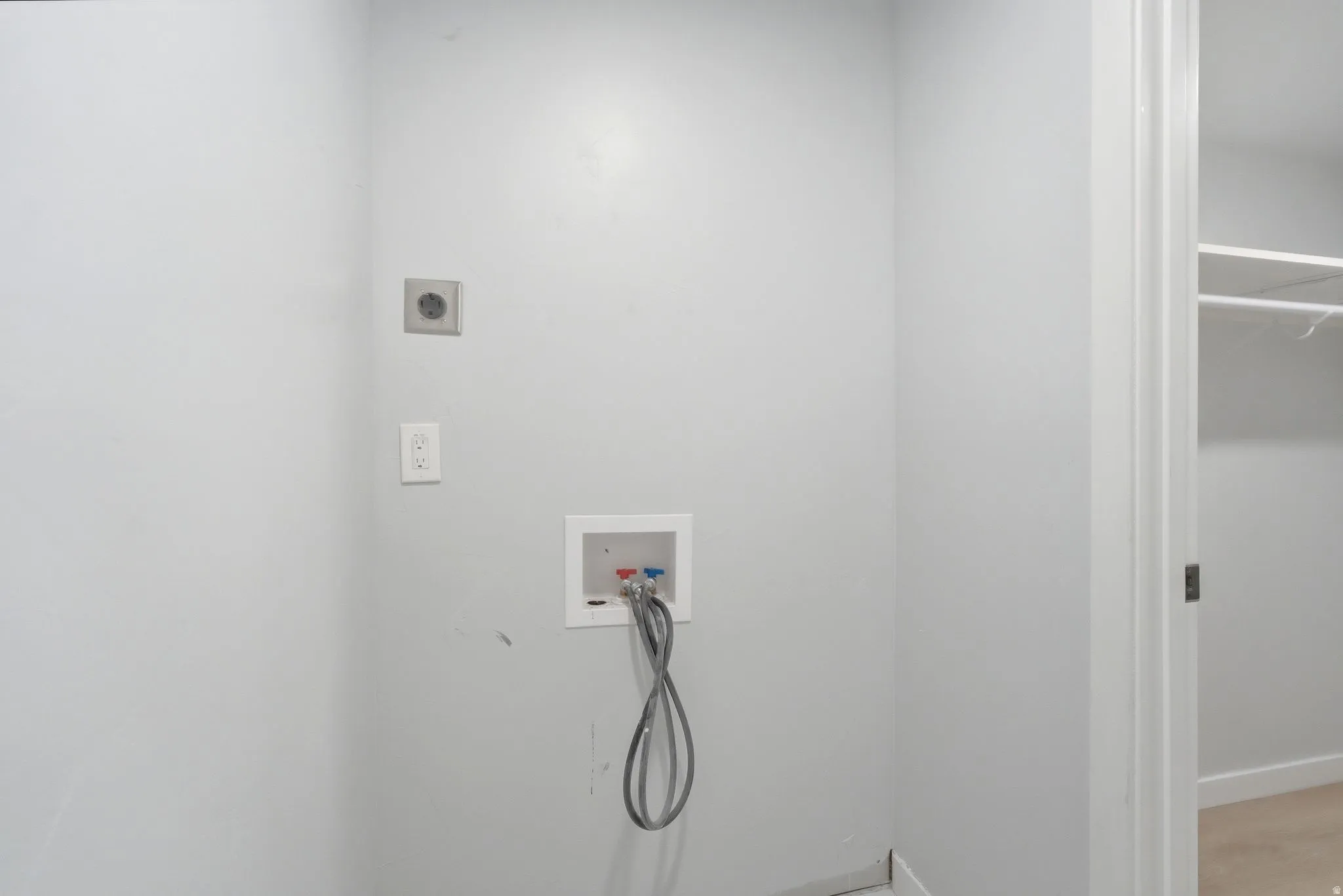 Laundry area with washer/dryer hookups and electrical outlets