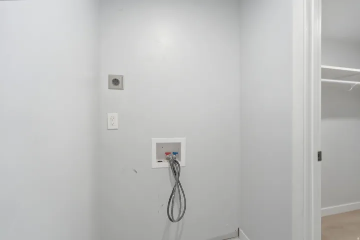 Laundry area with washer/dryer hookups and electrical outlets