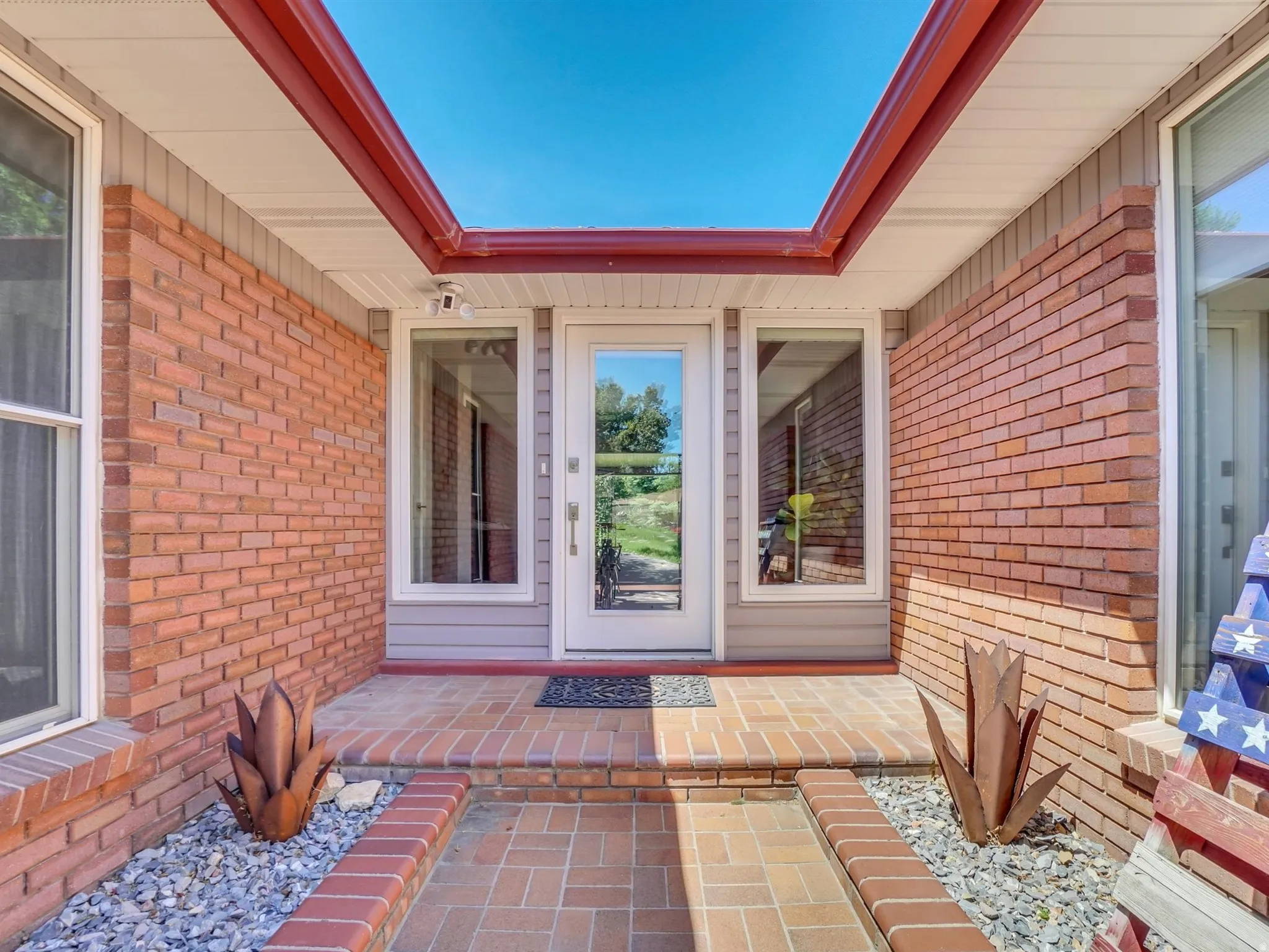 Brick exterior with a covered entry