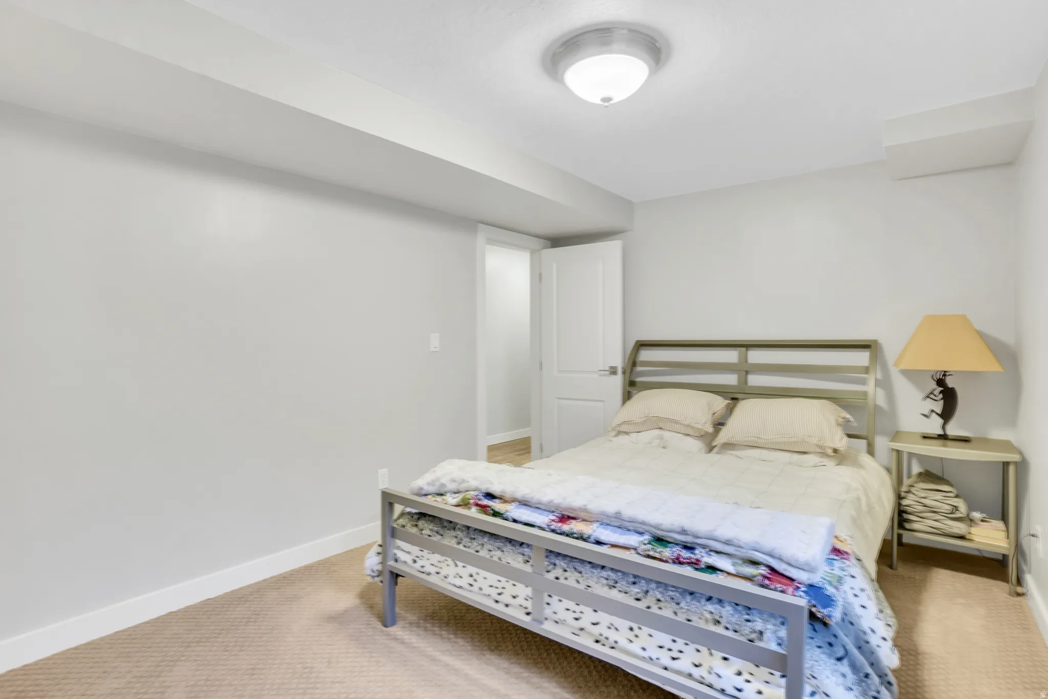 Neutral wall paint throughout, carpeted flooring, and white trim