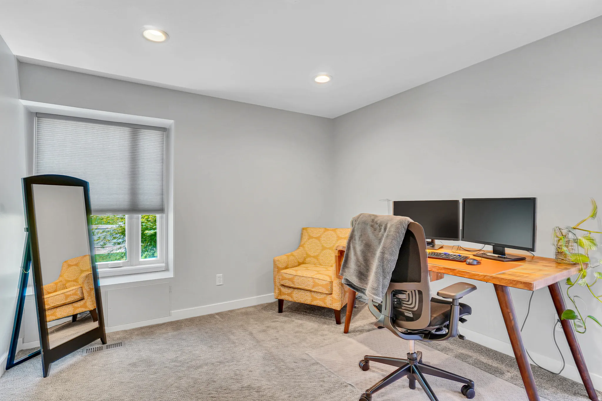 Neutral gray walls with recessed lighting