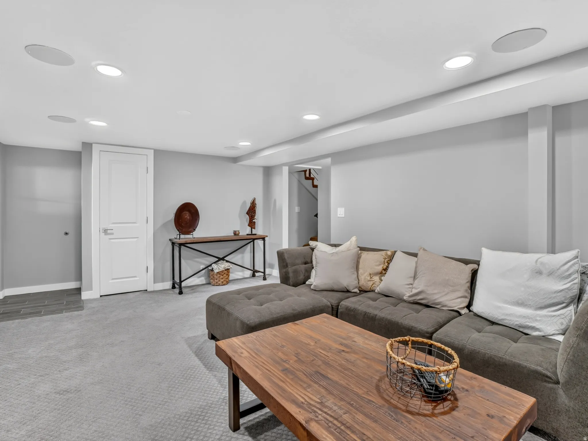 Carpeted lower level featuring recessed lighting and built-in ceiling speakers
