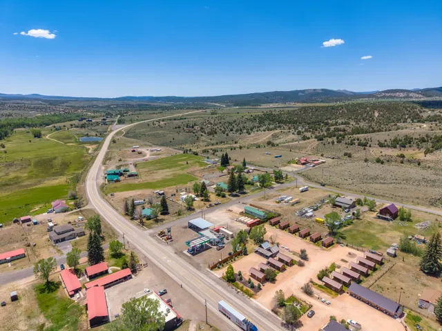 Expansive aerial perspective showcasing a community with numerous structures under clear skies