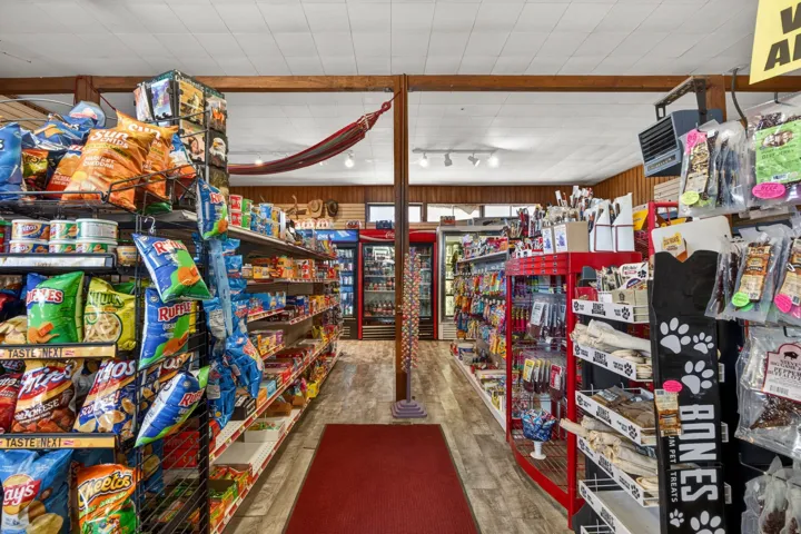 Retail interior featuring wood-finish flooring and extensive merchandising displays
