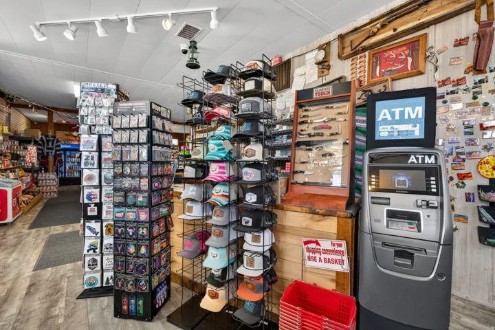 Retail store interior featuring track lighting and wood-finish flooring