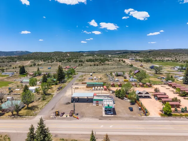 Commercial property featuring a prominent roadside location, covered fueling stations, and multiple structures