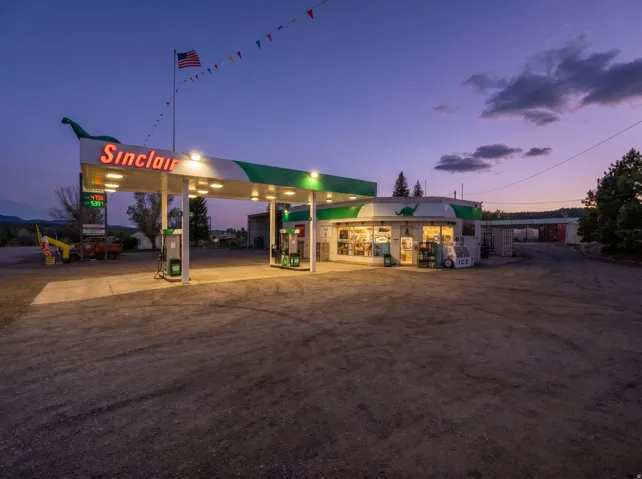 Commercial property featuring a Sinclair branded gas station with a convenience store and multiple fuel pumps