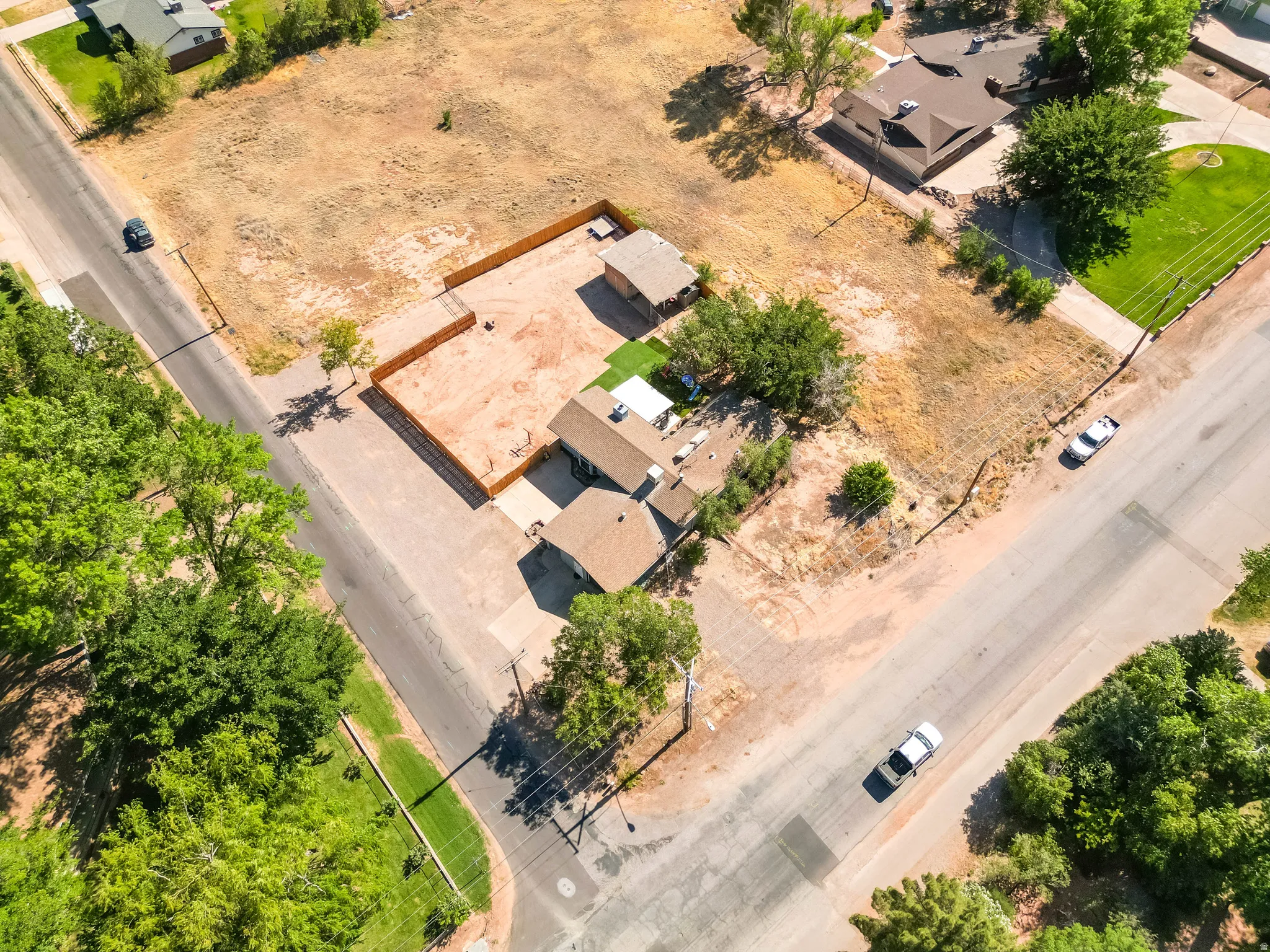 Aerial perspective showcasing a property with a substantial land footprint