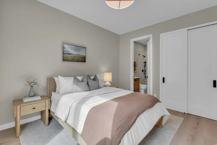 Light wood-finish flooring complements the neutral wall color