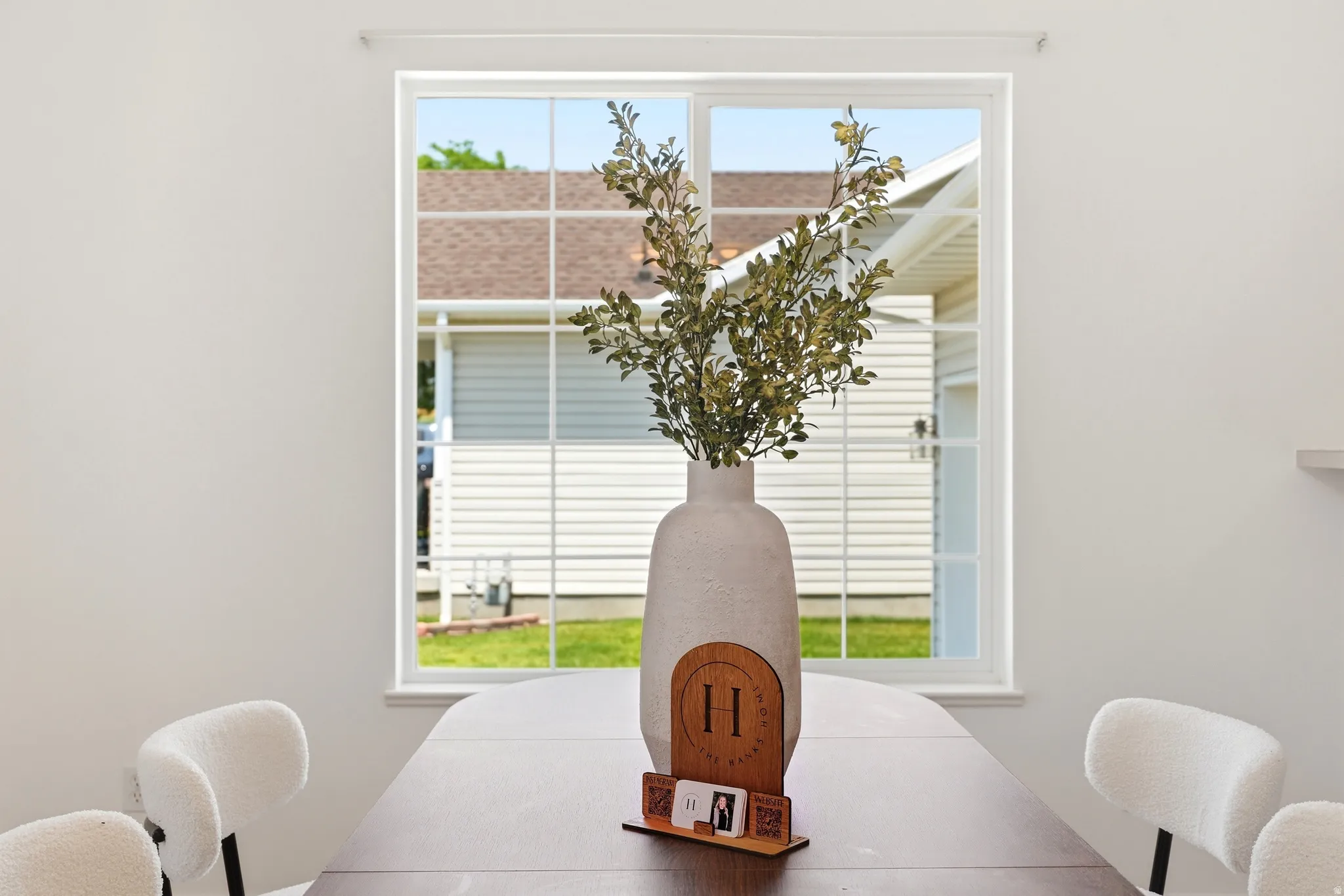 Dining area with a large window, providing natural light