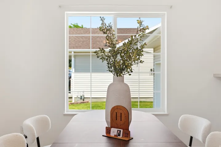 Dining area with a large window, providing natural light