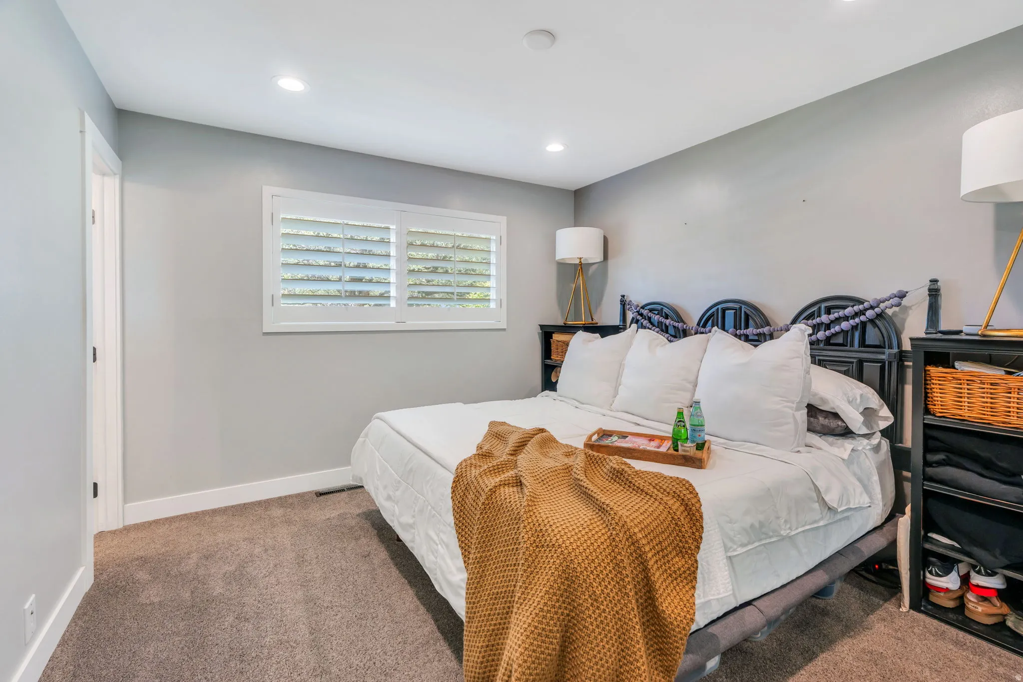 Main level primary bedroom with attached bathroom.