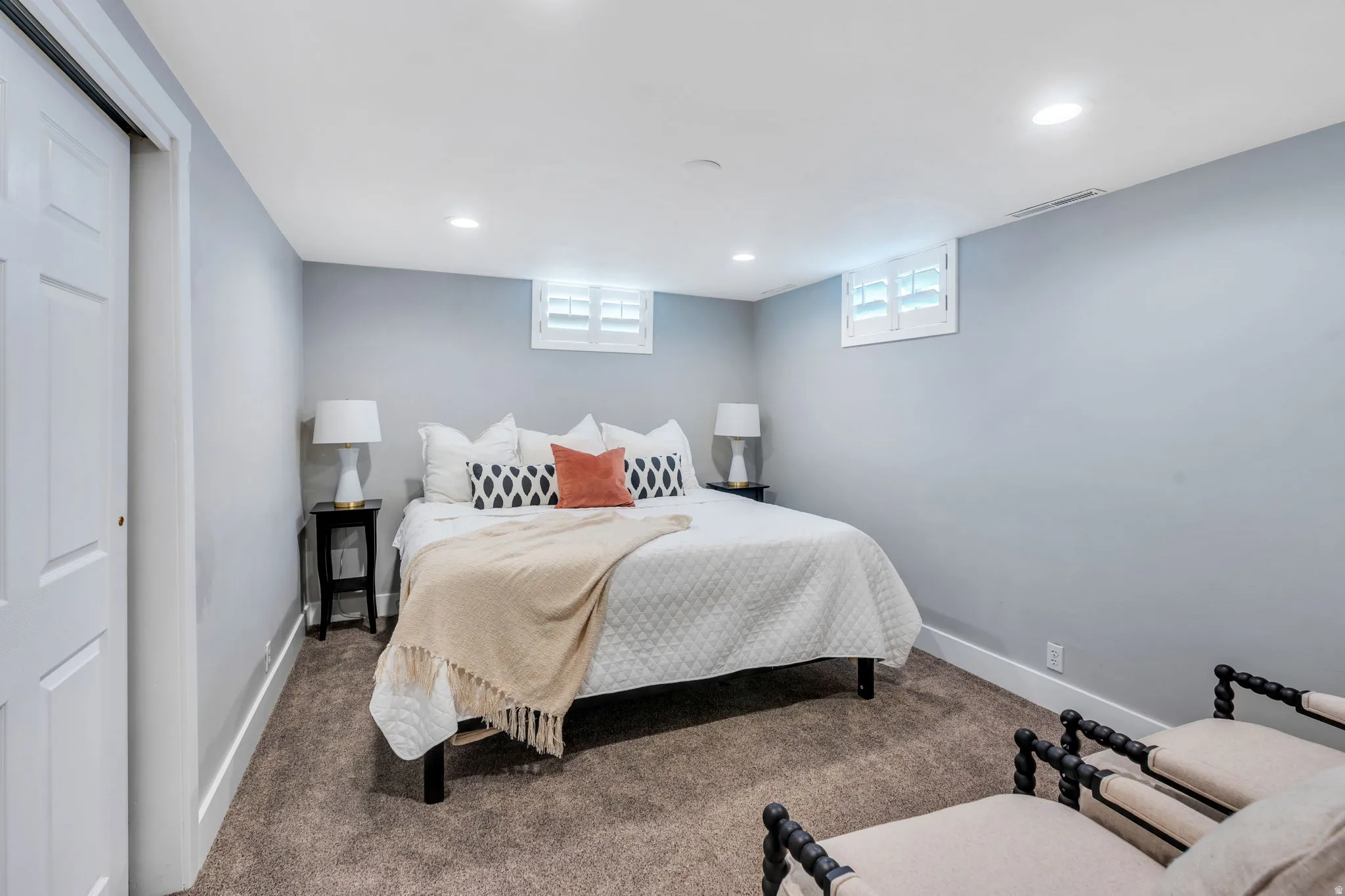 Bedroom #4 - neutral gray walls featuring white trim, recessed lighting, and carpeted flooring