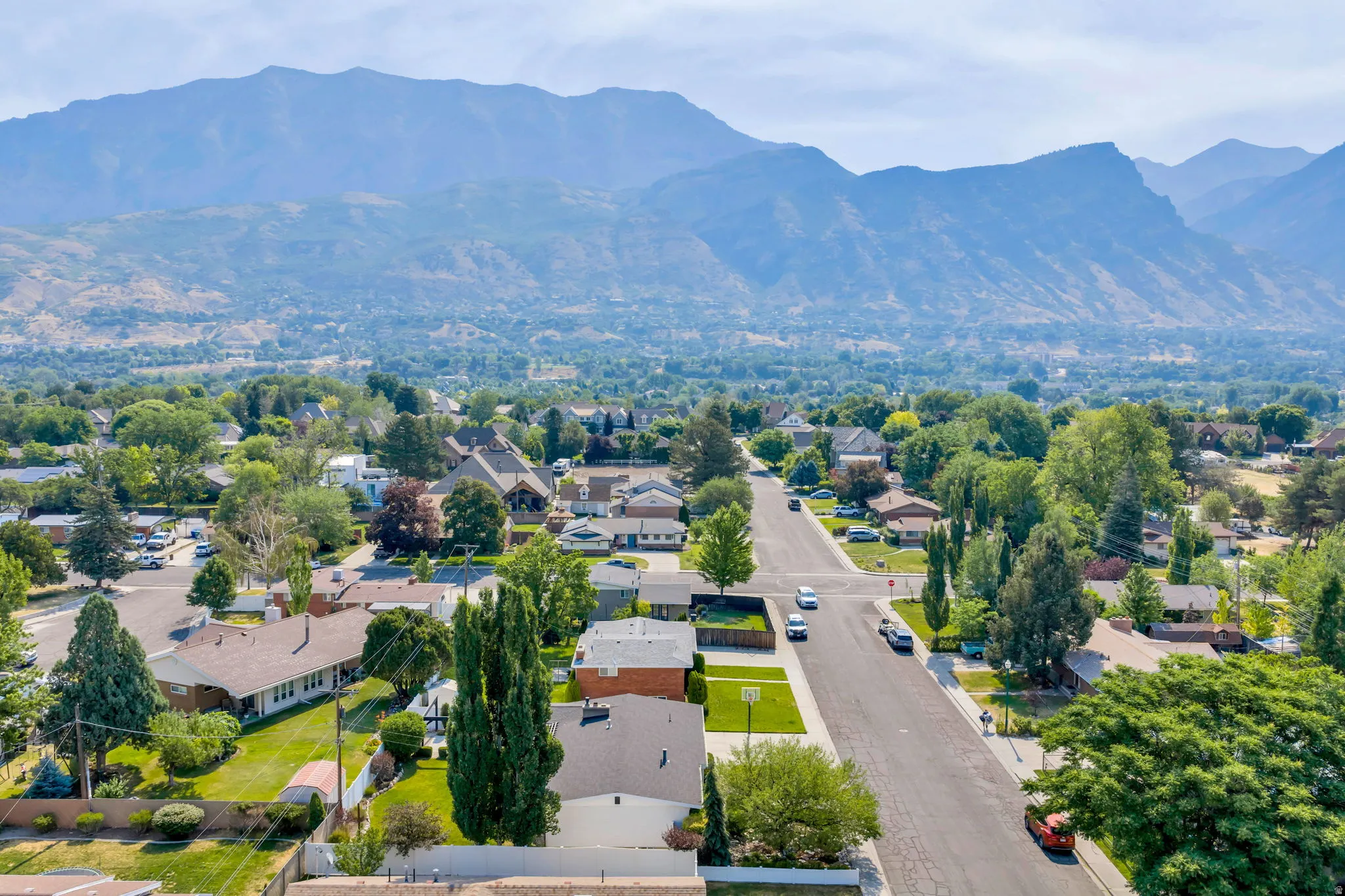 Expansive neighborhood setting with distant mountains forming a natural backdrop