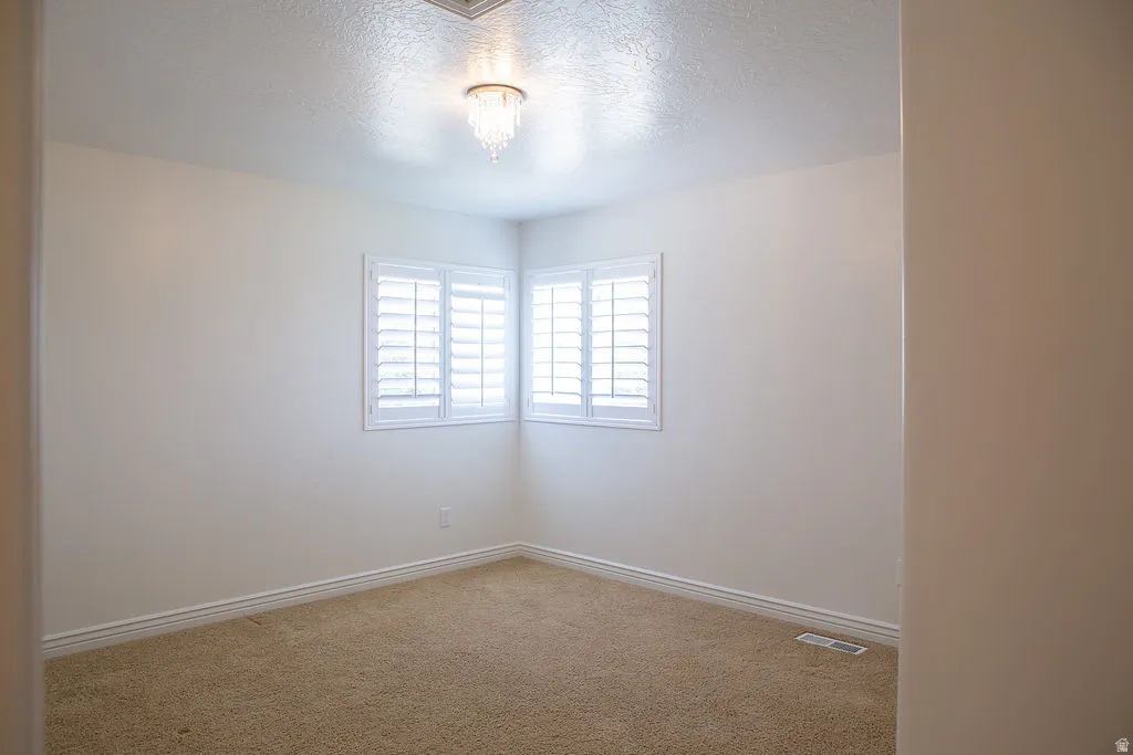 Corner windows with white plantation shutters