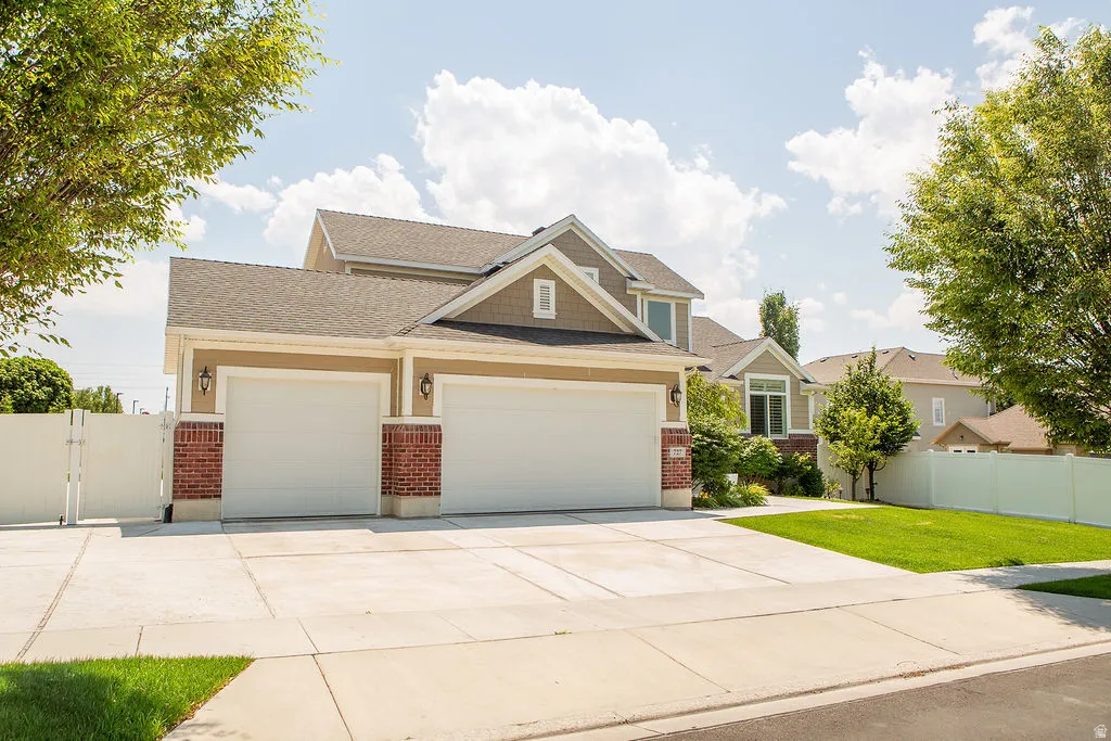 Two-car garage with white doors and brick pilasters