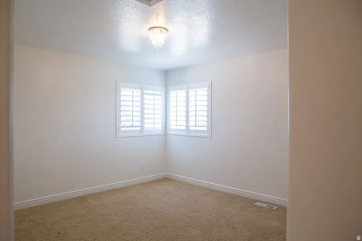 Corner windows with white plantation shutters