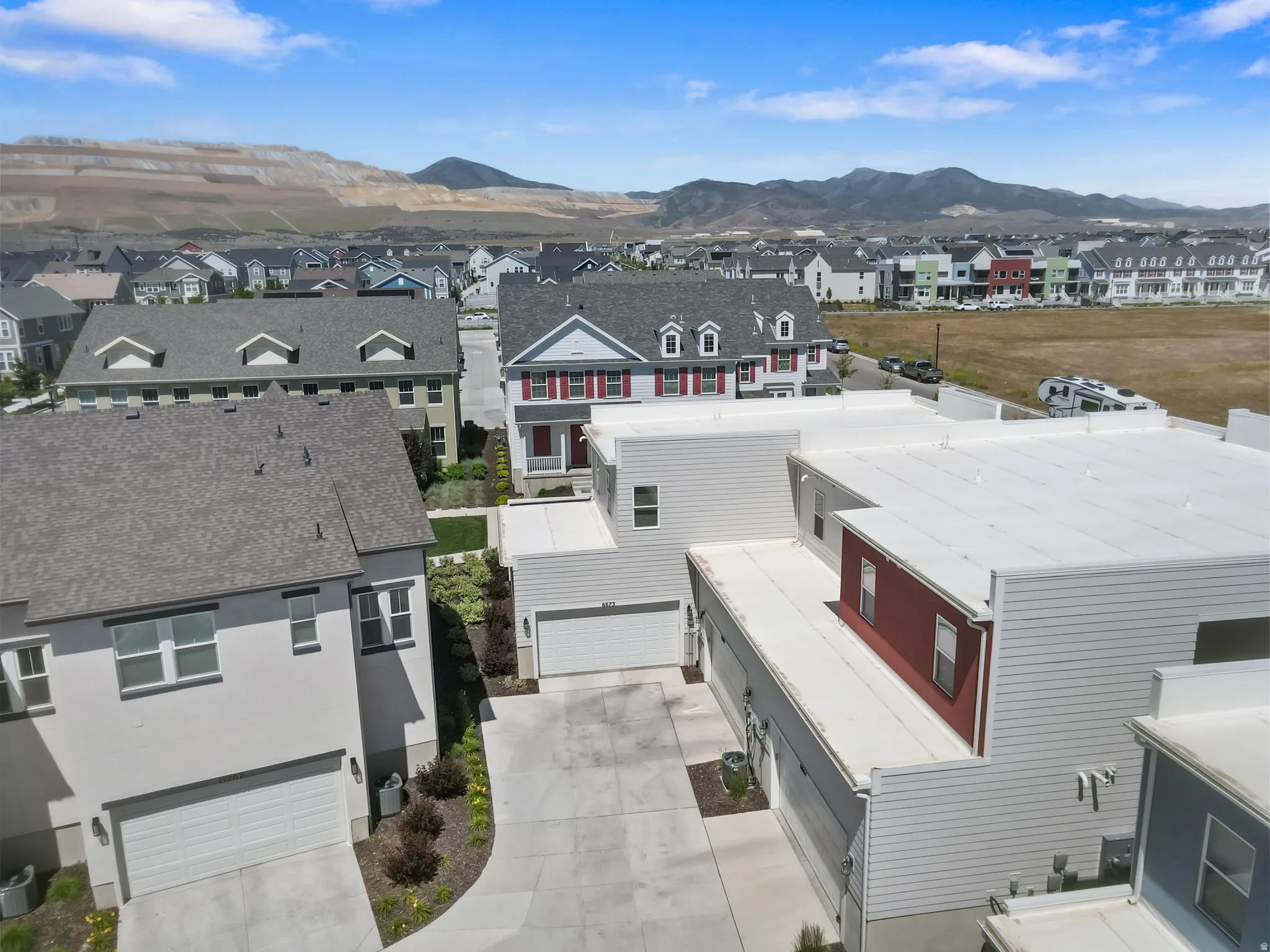 Spacious residential development featuring a mix of architectural styles, including multi-story residences with attached garages
