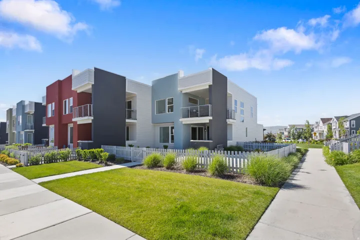 Modern townhome exterior featuring clean lines and a contemporary color palette