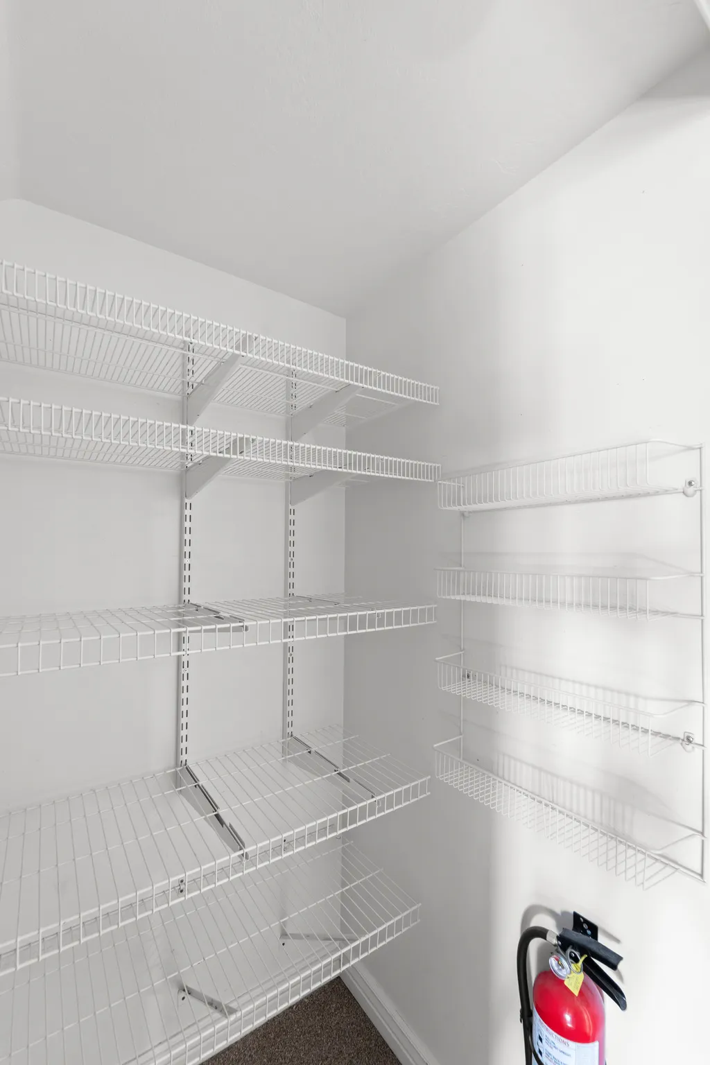 Interior storage area featuring extensive wire shelving systems