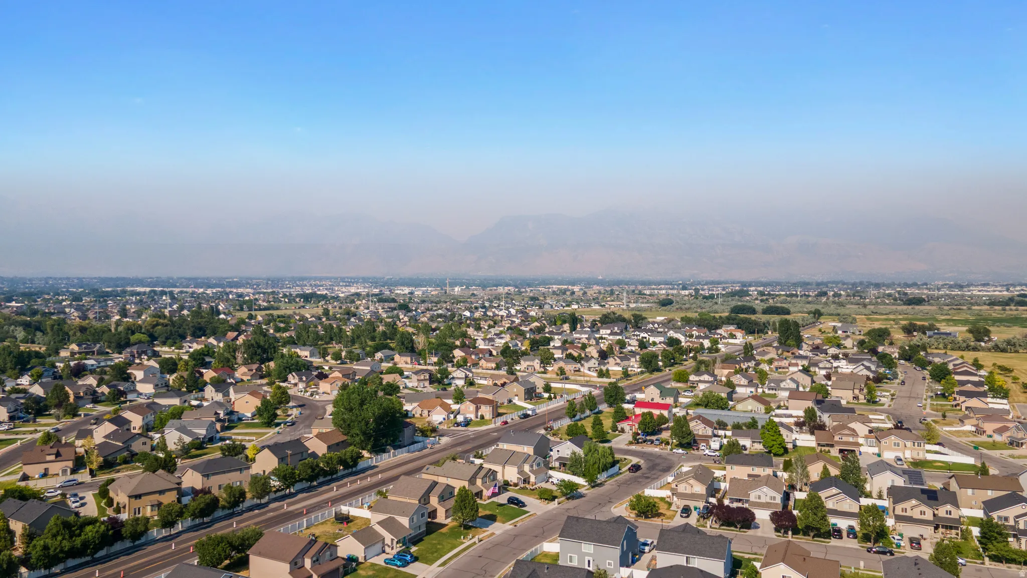 Aerial perspective showcasing a residential community with mature landscaping