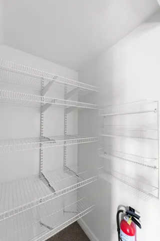 Interior storage area featuring extensive wire shelving systems