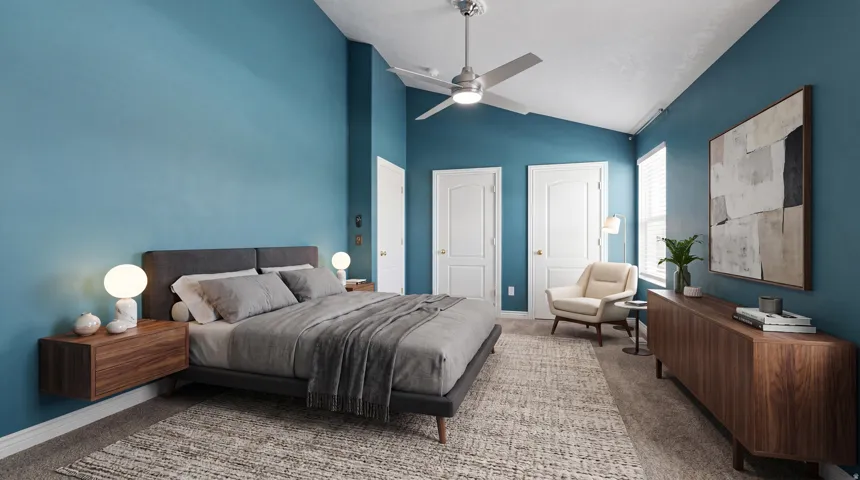 Vaulted ceiling bedroom featuring a contemporary ceiling fan, multiple white paneled doors, and natural light from a window with blinds