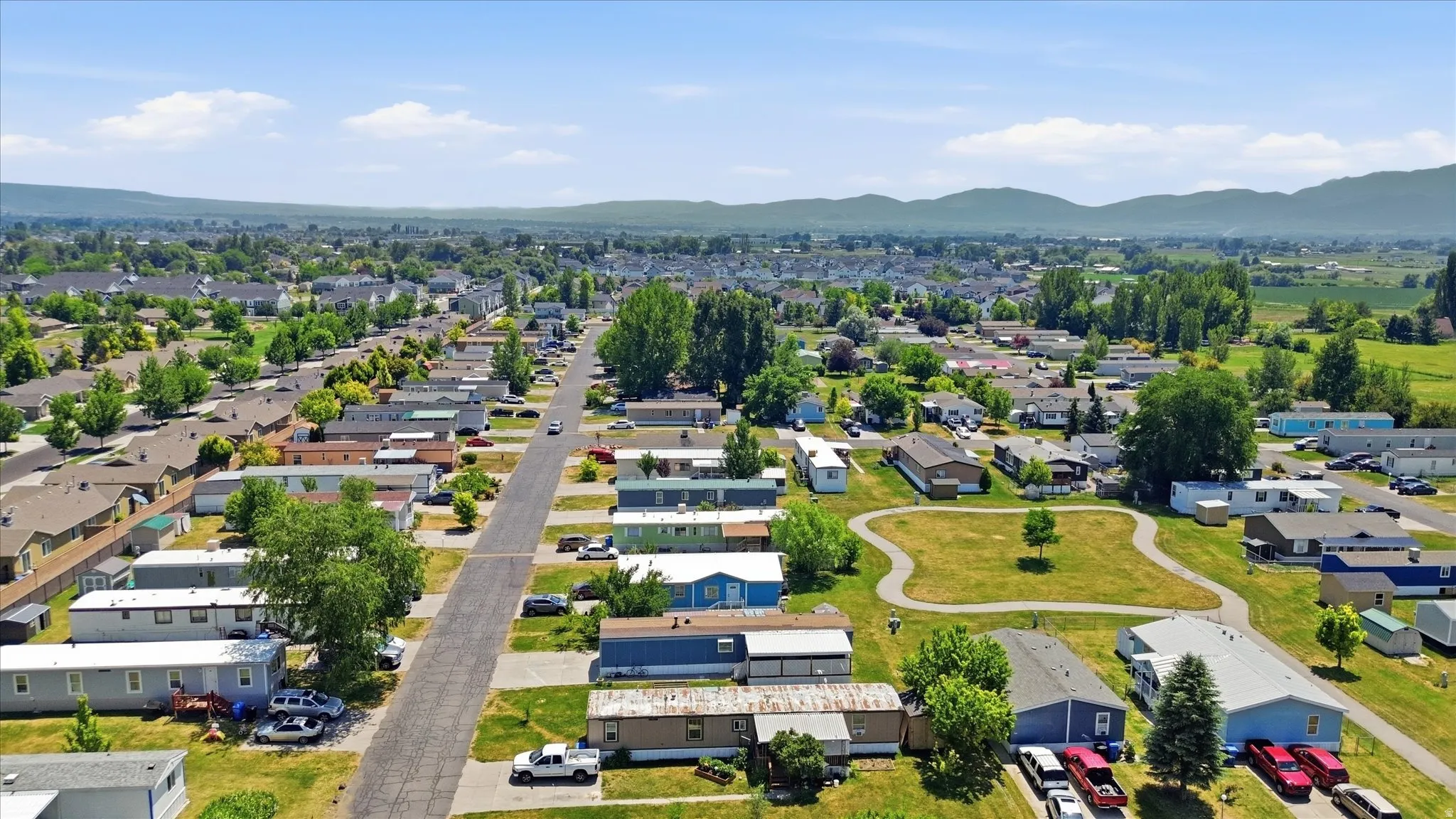 Expansive community featuring paved streets and varied residential structures