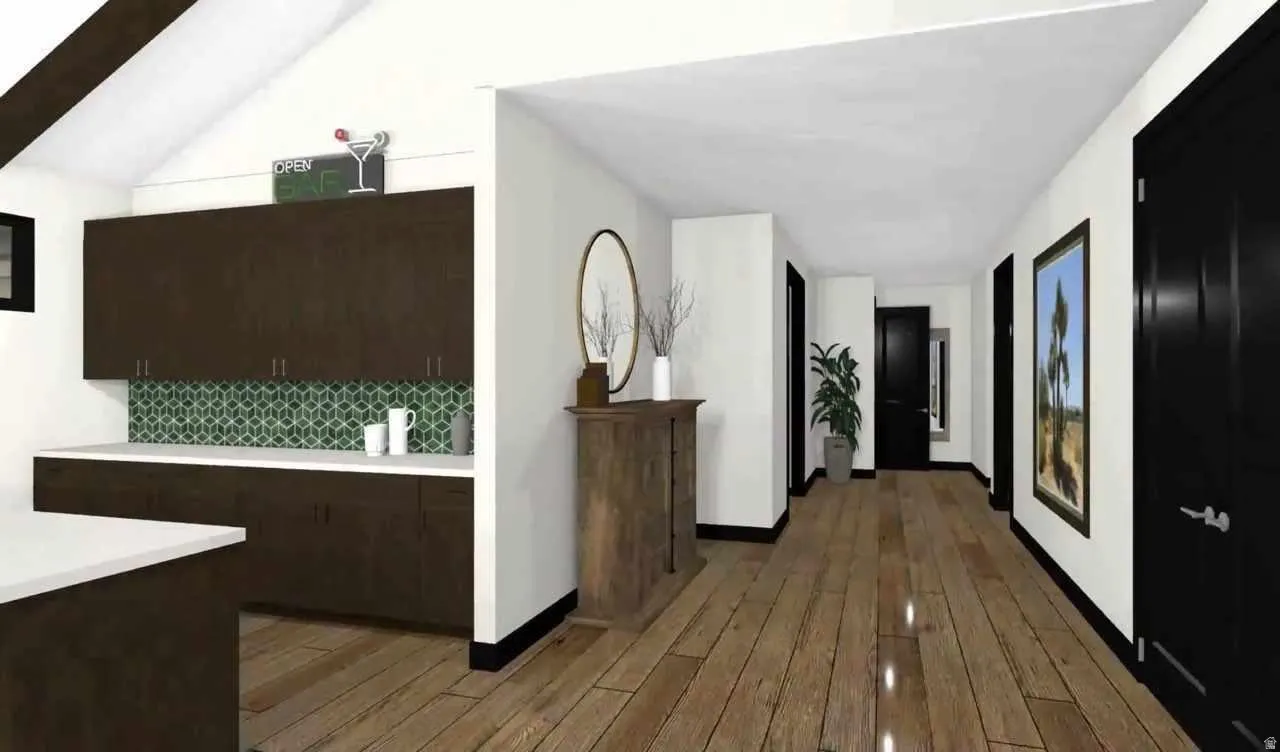 Hallway featuring wood-finish flooring, dark trim, and multiple dark doors