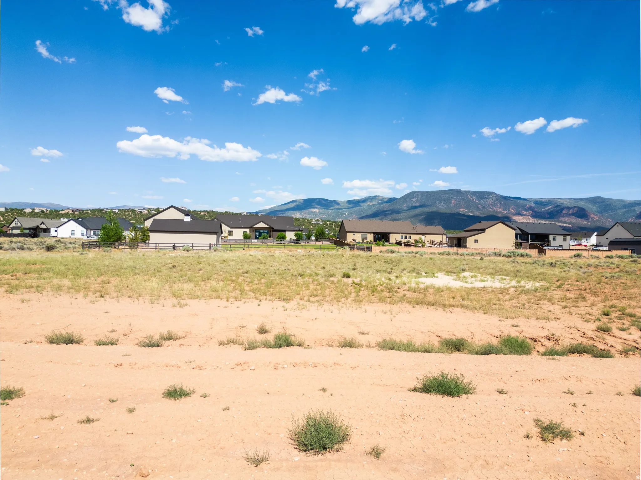 Expansive undeveloped land parcel with a clear boundary, offering a flat buildable area