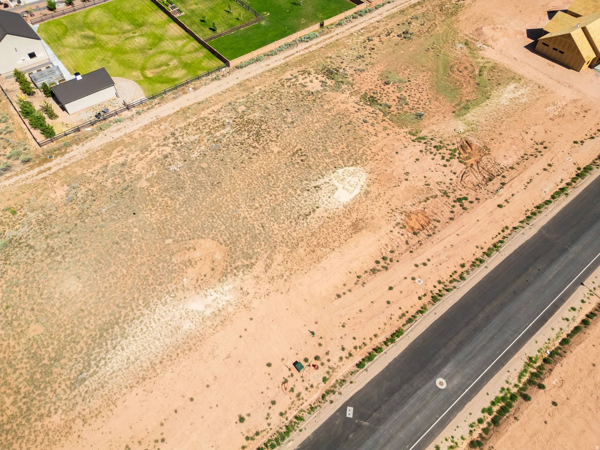 Expansive undeveloped land parcel featuring natural desert vegetation