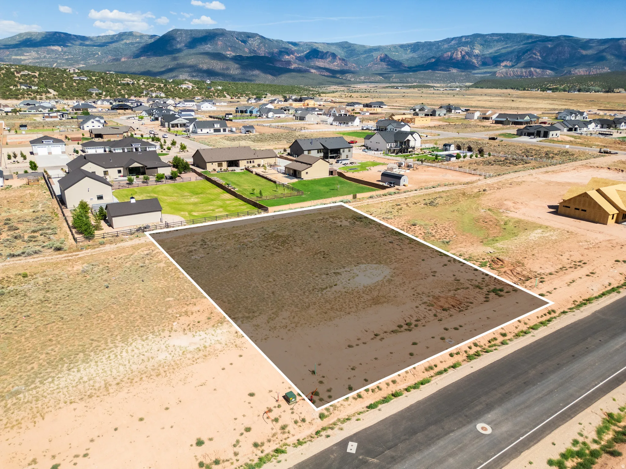 Expansive land parcel featuring desert landscaping and mountain scenery
