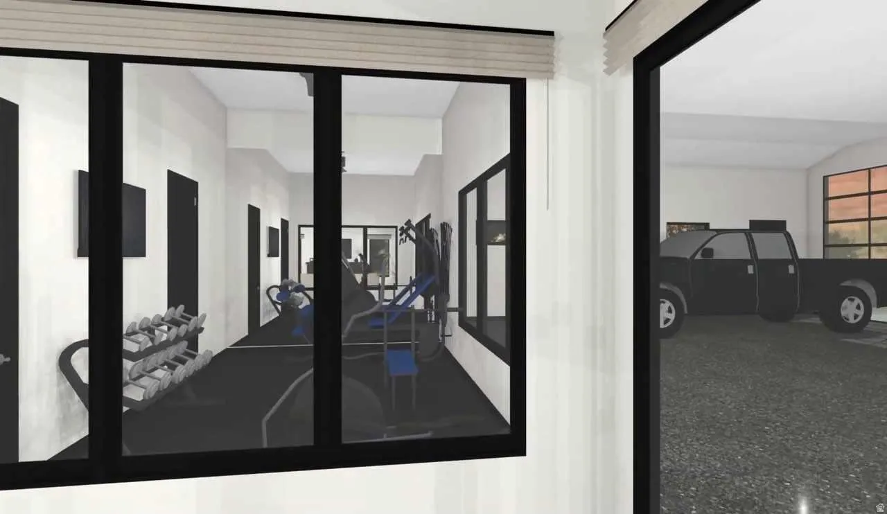 Interior space featuring a gym area with dark frame windows, white walls, and dark flooring