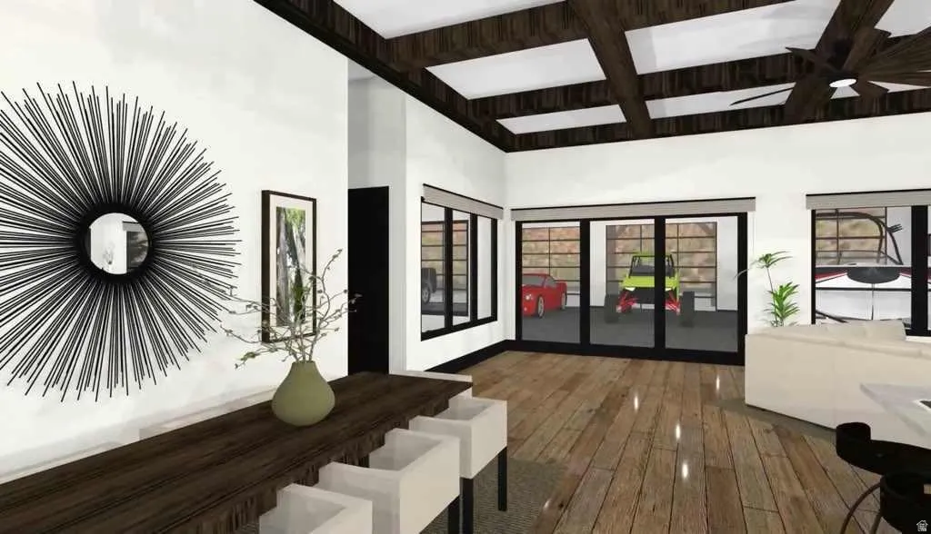 Open-concept interior featuring wood-finish flooring, exposed beam ceiling details, expansive windows, and a large multi-panel glass door
