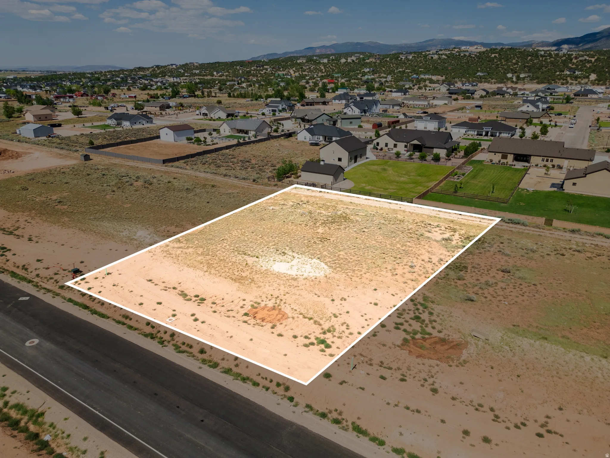 Expansive land parcel featuring direct road frontage and a level topography
