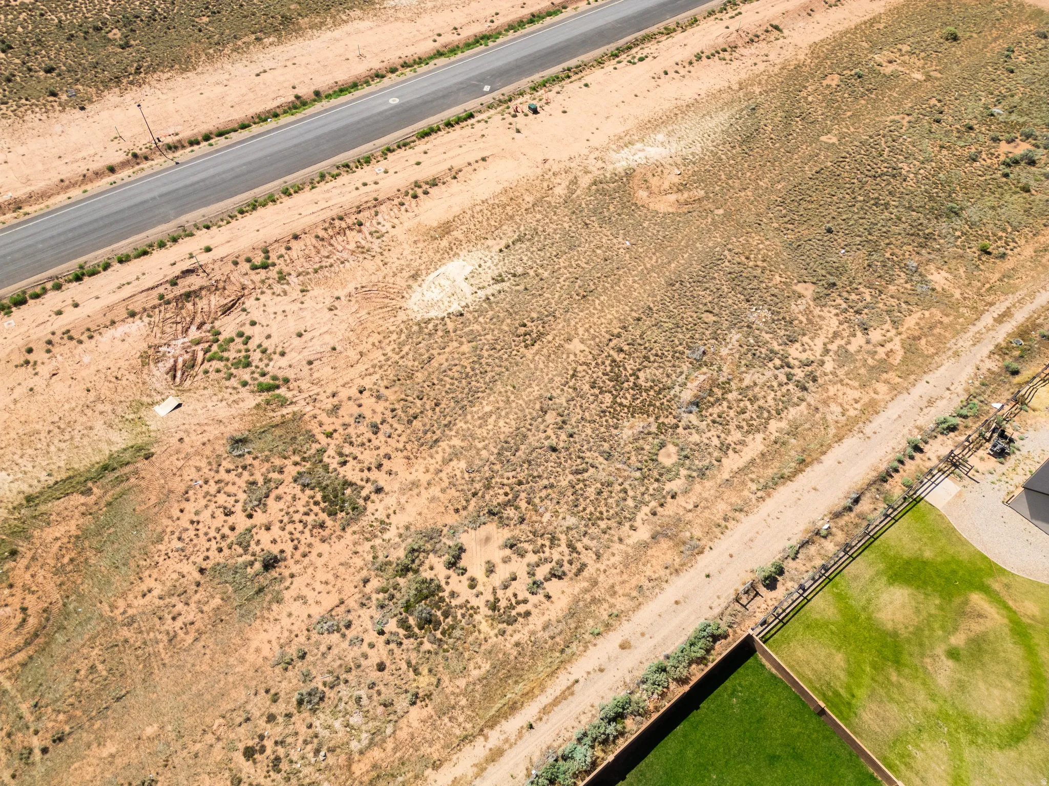 Expansive undeveloped land parcel featuring natural desert landscaping