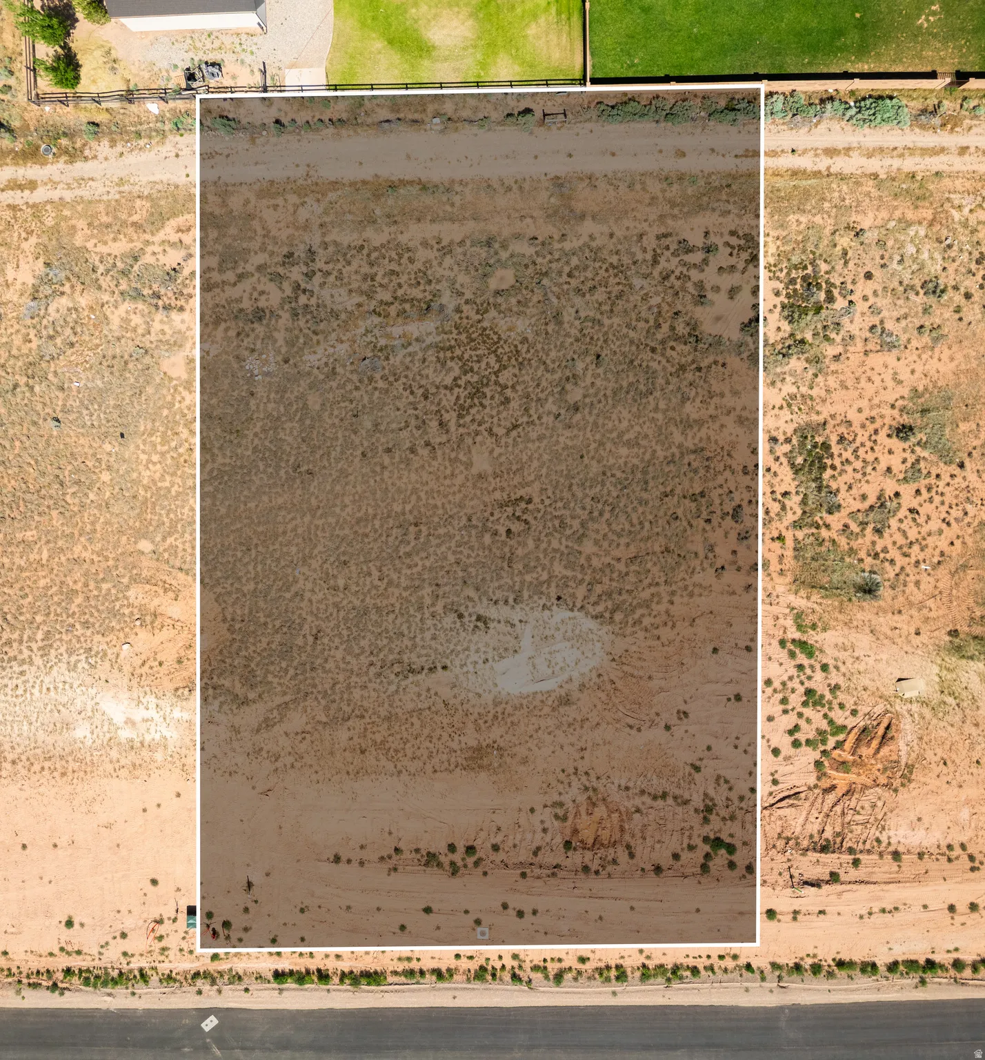 Aerial View. Depicting the property's boundaries and surrounding terrain