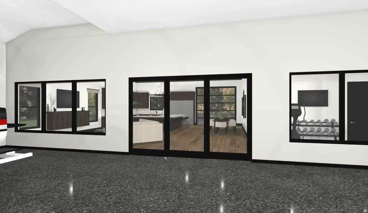 Black-framed sliding glass doors open to an interior space featuring wood-finish flooring
