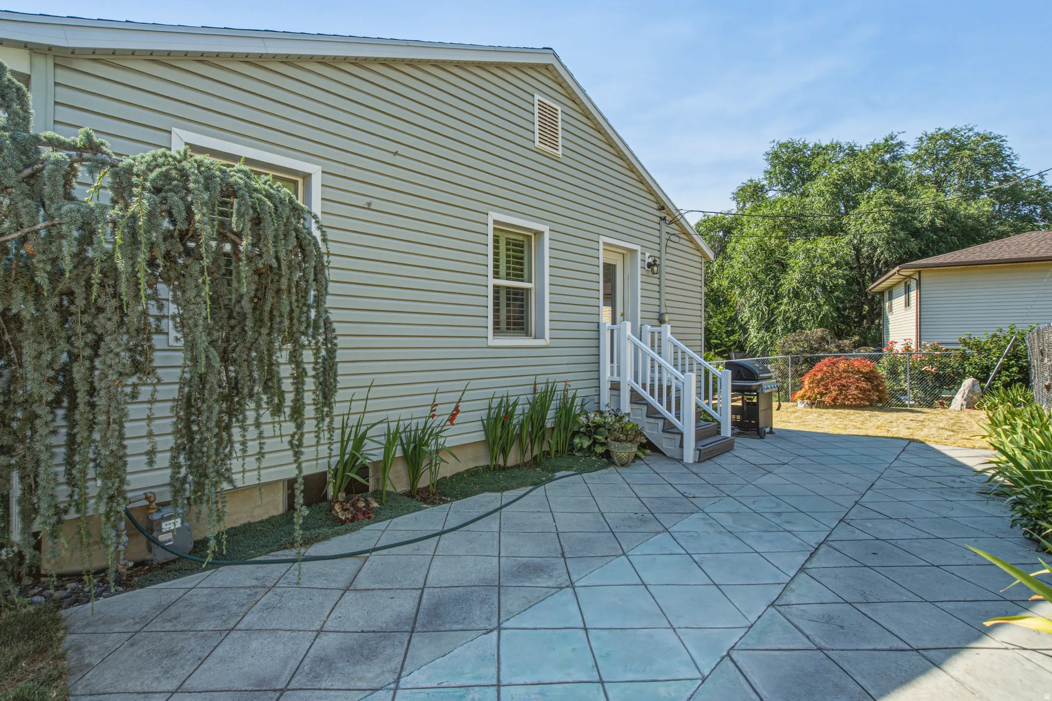 Expansive paver patio featuring a geometric pattern