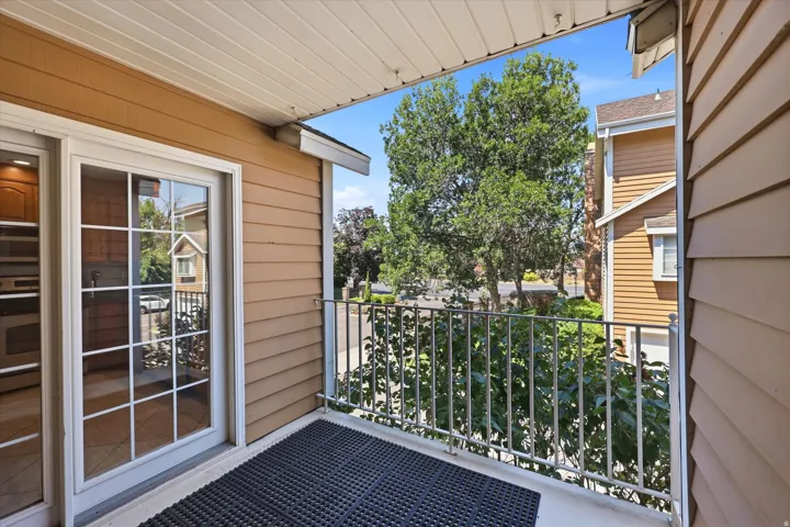 Balcony with a metal railing and a sliding glass door