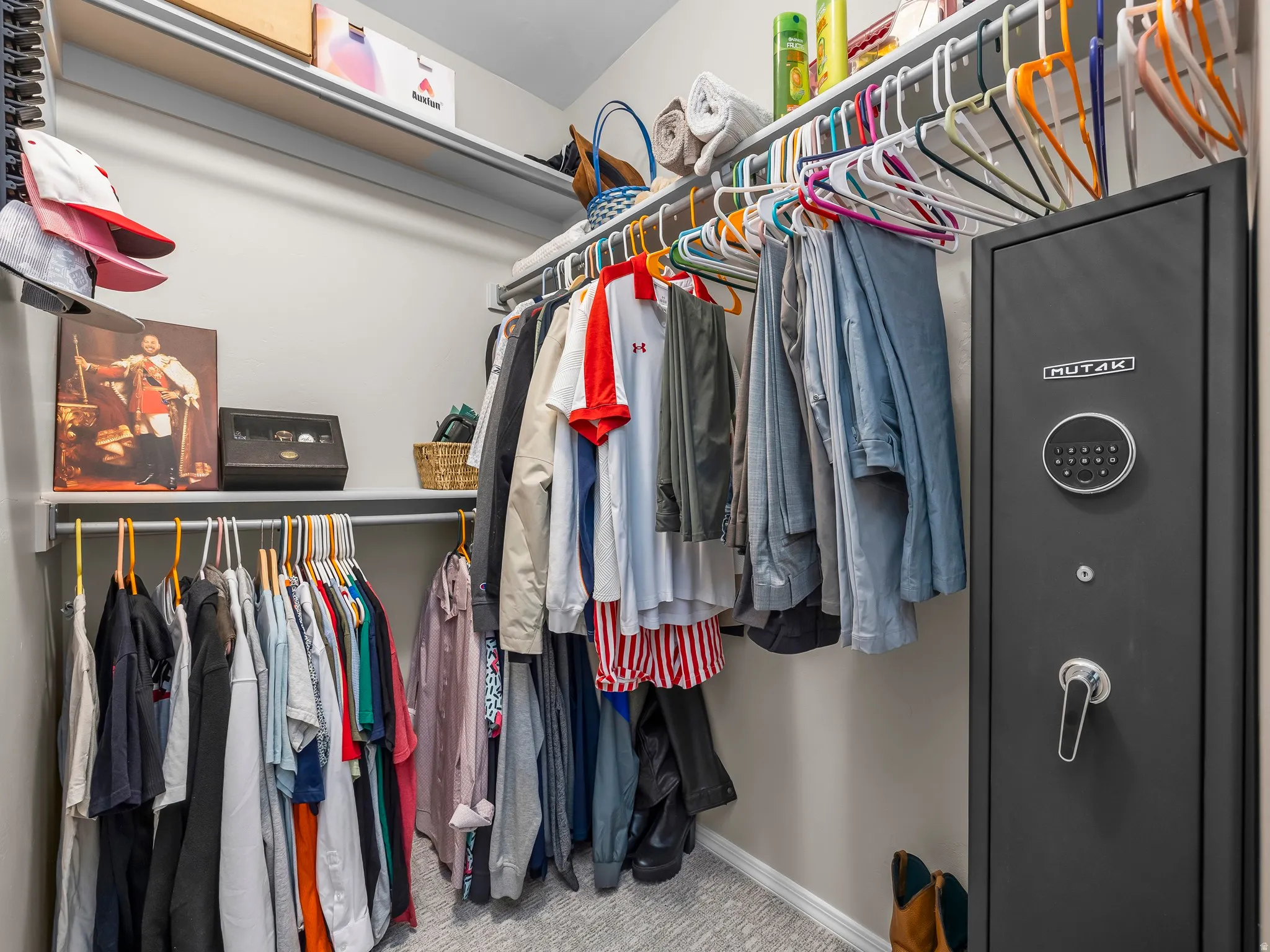 Custom closet system featuring multiple hanging rods and shelving