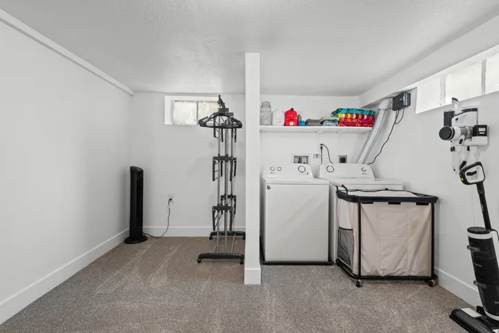 Dedicated laundry area with white walls and baseboards