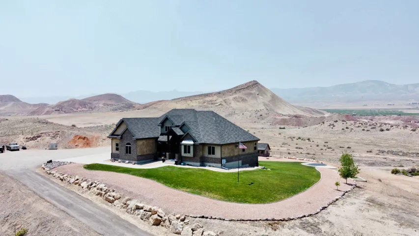 Contemporary home with varied façade finishes including stone and siding