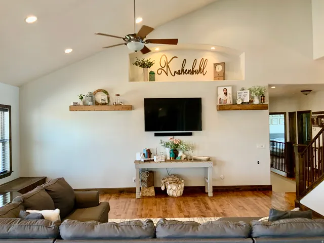 Vaulted ceiling featuring recessed lighting and a ceiling fan