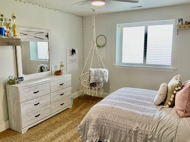 Neutral wall color with a window featuring horizontal blinds