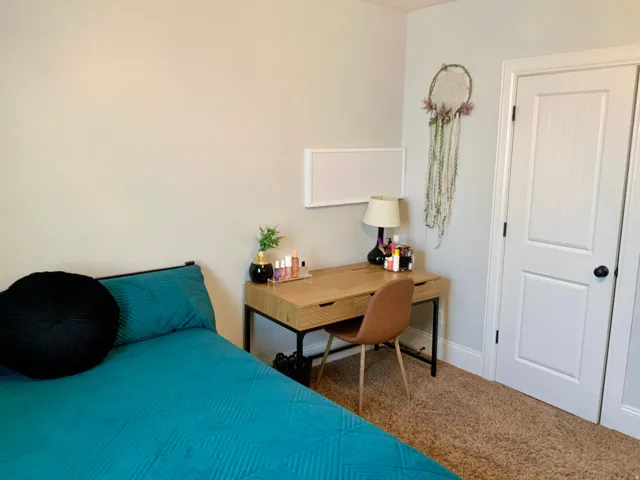 Wall-to-wall carpeting and white baseboards