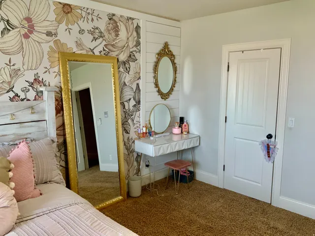 Floral accent wall with a shiplap panel detail