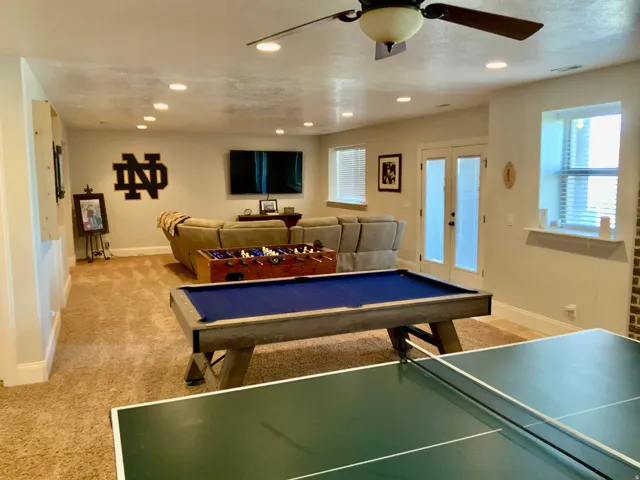 Spacious recreation room featuring recessed lighting and wall-to-wall carpeting